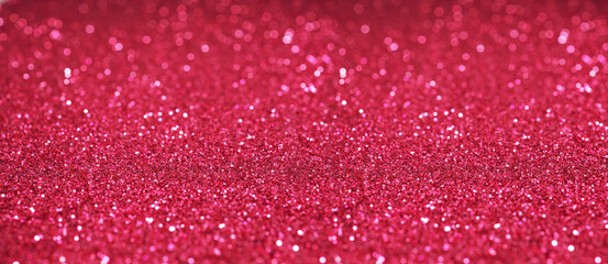 Banner Defocused abstract pink red twinkle light background. Pink red glittery bright shimmering...