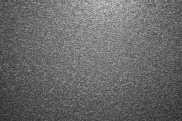 evocative black and white image of glazed wall texture
