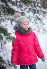 Child in winter. A little girl,  playing in the winter outside.