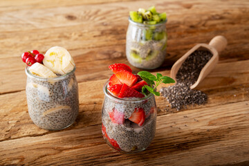 three Chia pudding on wooden plank