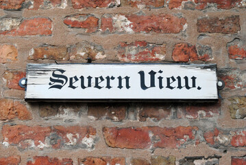 Close Up of Old Wooden Sign on Brick Wall 'Severn View' 