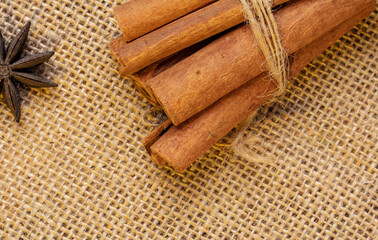 Cinnamon sticks on a wooden background