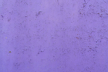 the wooden background is painted purple, the aged paint is peeling off