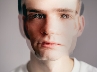 portrait of a young man, a guy out of focus. Multiple personality disorder, bipolar disorder,...