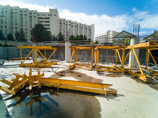 Construction site with concrete and steel and crane lifting equipment