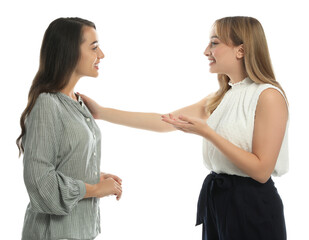 Young women in casual clothes talking on white background