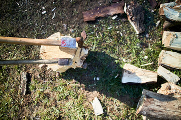copping wood outdoors with an axe