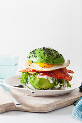 keto paleo diet avocado breakfast burger with bacon, egg, tomato