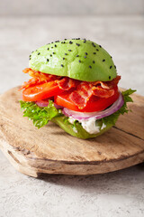 keto paleo diet avocado burger with bacon, lettuce, tomato