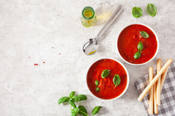 tomato and bell pepper vegetarian soup on green background