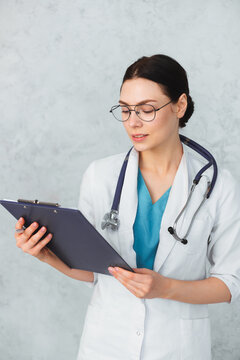 Young female doctor with stethoscope and folder. caucasian brunette