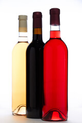 Set Of White, Rose, And Red Wine Bottles. Three bottles with red, pink and white wines isolated on white.