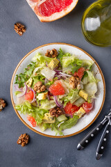 Salad with grapefruit, walnuts and cheese. Top view