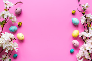 Happy Easter with eggs and flowering branch, top view