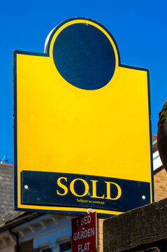 Generic blank estate agent house for sale sold sign for use during the booming home ownership housing property market with copy space, stock photo image