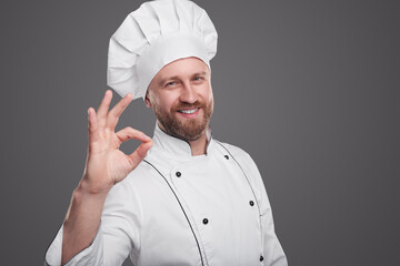 Friendly male chef gesturing OK