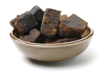 brown cubes of sugar on white background