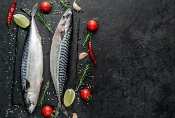  Fresh raw mackerel fish on stone background with copy space for your text

