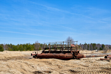 Fototapeta premium Old ship in the desert in the sand on sunny summer day and blue sky on the background