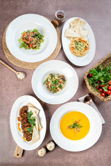 Several dishes are shot from above in the decor against the background