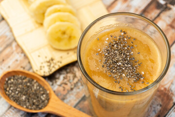Healthy breakfast: chia seed with banana in a glass close-up on the table. horizontal. Selective focus
