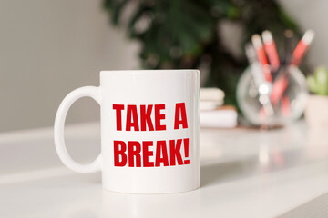 Take a break - text on mag in office table