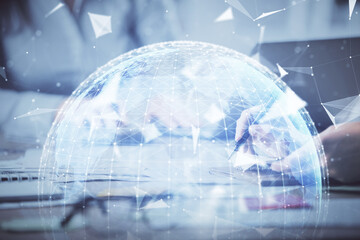 Double exposure of woman hands typing on computer and business theme hologram drawing. Success concept.