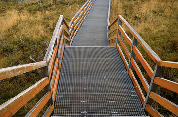 Empty stairway and boardwalk among the fall foliage © jobi_pro