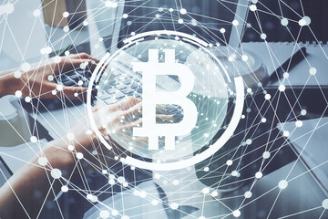 Double exposure of woman hands typing on computer and crypto market theme hologram drawing. Blockchain concept.