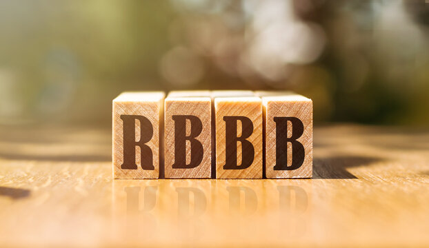 Word RBBB - Right Bundle Branch Block. Made With Building Wooden Blocks On Table In Sunlight.