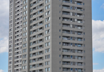 Windows of a white building with white cloud background