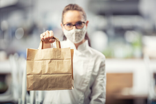 Recycklable Paper Bag Used For A Takeaway Delivery Of Food During The Coronavirus Pandemic