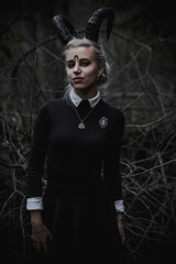 Naklejka premium Witch in the form of a student in the forest