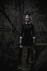 Witch in the form of a student in the forest