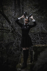 Naklejka premium Witch in the form of a student in the forest