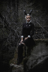 Naklejka premium Witch in the form of a student in the forest