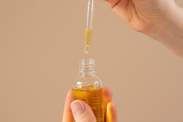 Castor oil for eyelashes and eyebrows for hair growth in a glass jar with a dropper