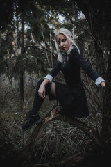 Obraz premium Witch in the form of a student in the forest