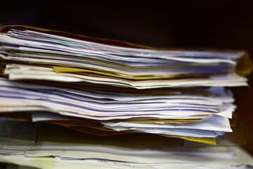 Stack of old papers, books, data sheets.