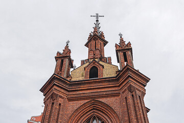 Red brick St. Anne's church (1500) - Flamboyant Gothic and Brick Gothic styles Roman Catholic Church in the Old Town of Vilnius. Lithuania.