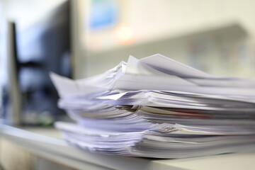 Stack of papers in the office. Close up. Documents. Files.