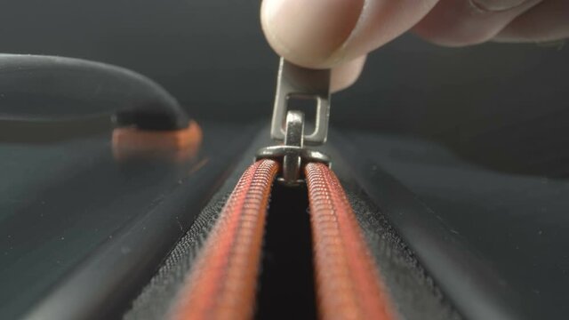 The opening of the luggage bag zipper as seen on a closer look