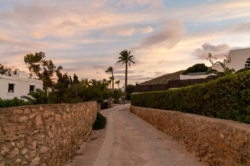 Fototapeta premium road leading to idyllic vacation homes on the Costa del Sol in Agua Amarga in Andalusia at sunset