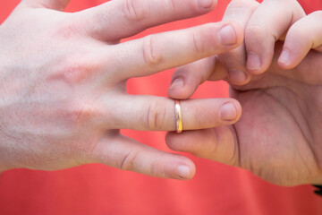 Man takes off a wedding ring, background