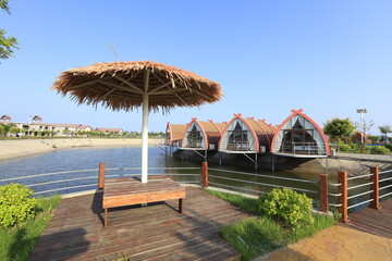 Wooden houses on the water,  log cabins by the sea