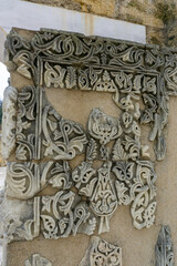detail view of Arabic calligraphy artwork in a wall in the ruins of Medina Zahara in Cordoba