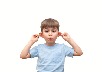 A cute little boy holds his ears and looks at the camera. On an isolated white background