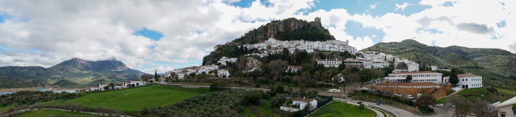 Fototapeta na wymiar panorama view of the whitwashed Andalusian village of Zahara de la Sierra and its Moorish Castle on the hilltop