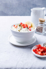 Healthy breakfast with cottage cheese and banana, flaxseed and seasonal fruits.