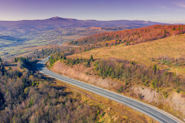 Winding highway in the autumn mountains. Drone view. Beautiful natural landscape. The Carpathians. Ukraine